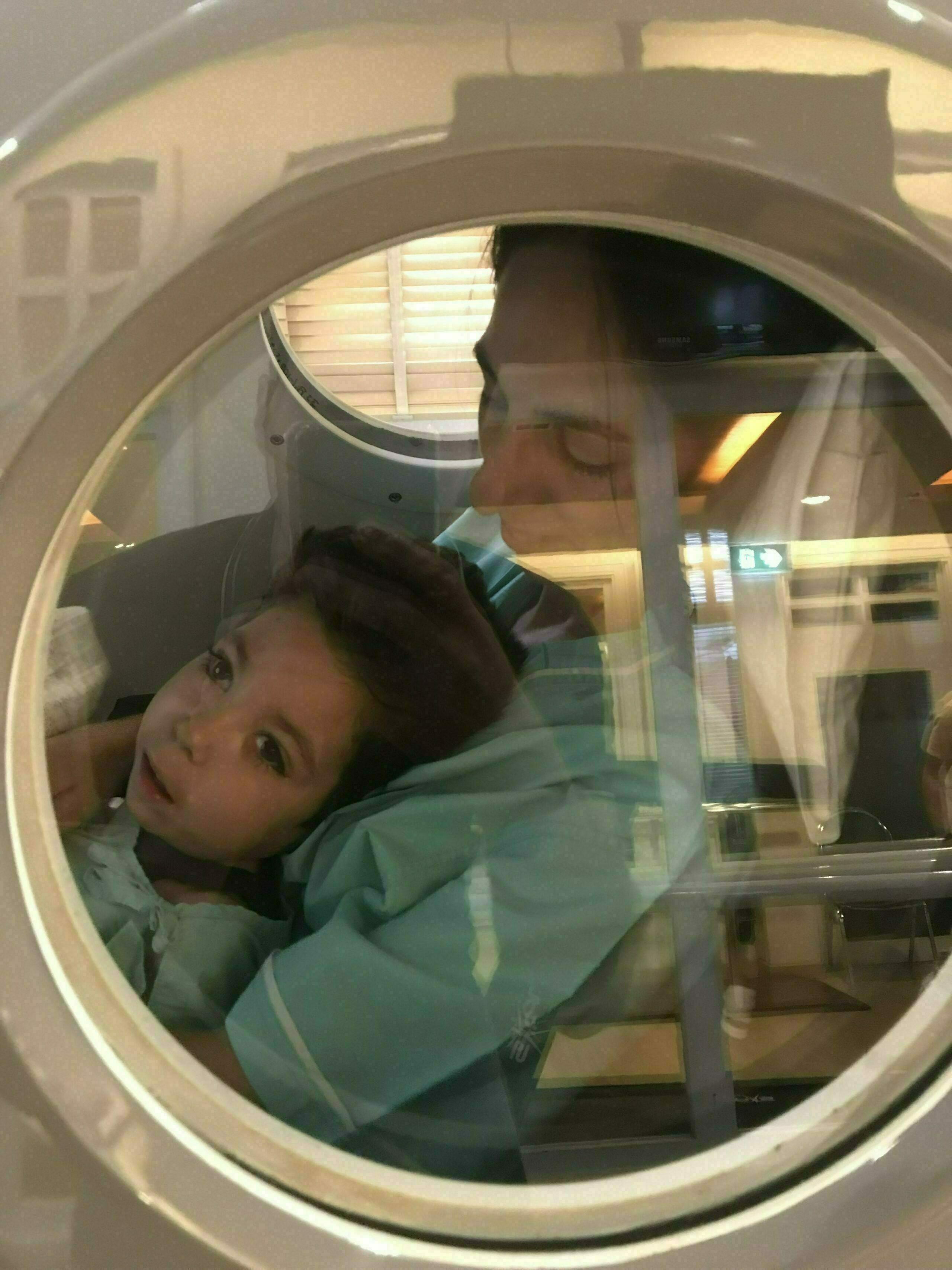 Here is an image of Samuel taking a ride in the hyperbaric oxygen therapy chamber