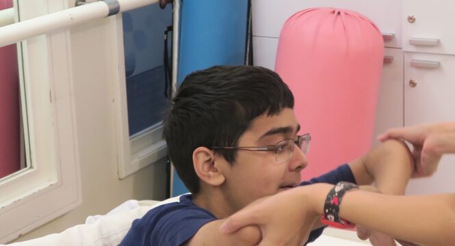 Saif during a physiotherapy session